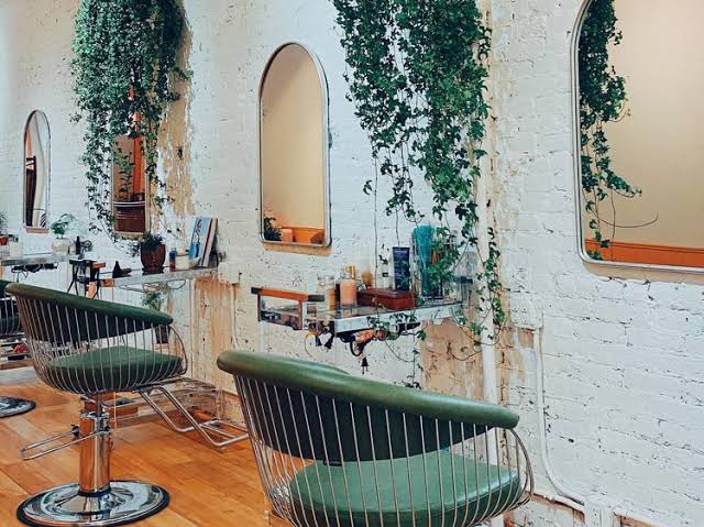 A premium Manhattan salon offers tailored styling strategies designed to keep your hair flawless through every seasonal transition., AI generated