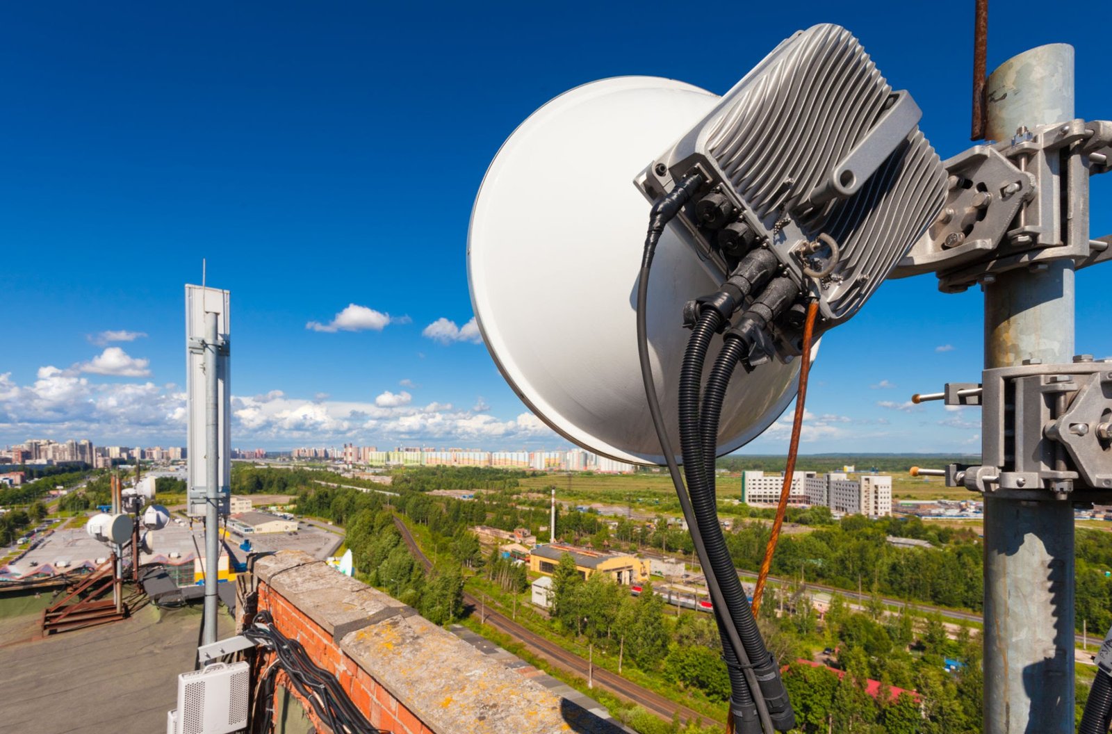 Fixed wireless access equipment on an urban structure, AI generated